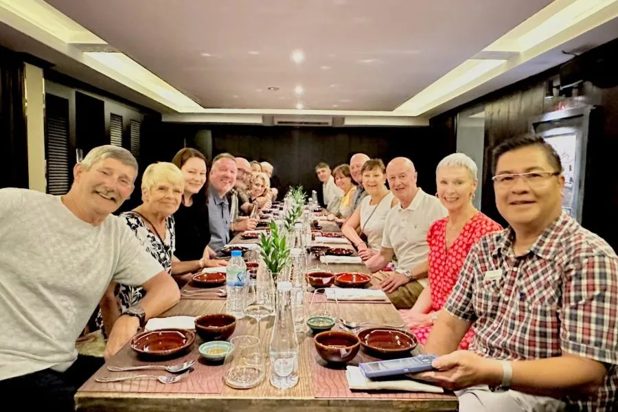 a group of travelers sitting at a table